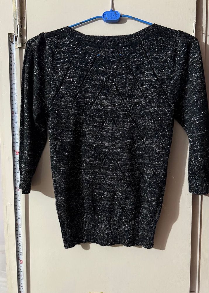 Black stylish top with shimmery interlacing
