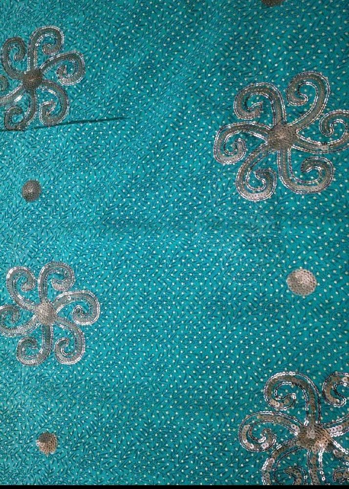 Beautiful Teal Saree with Silver Embellishments