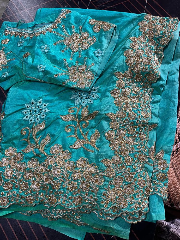 Beautiful Teal Embroidered saree with 34inch blous