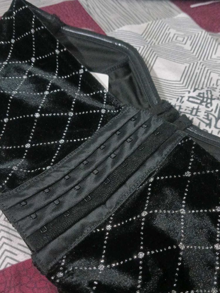 Black geometric tube neck corset top