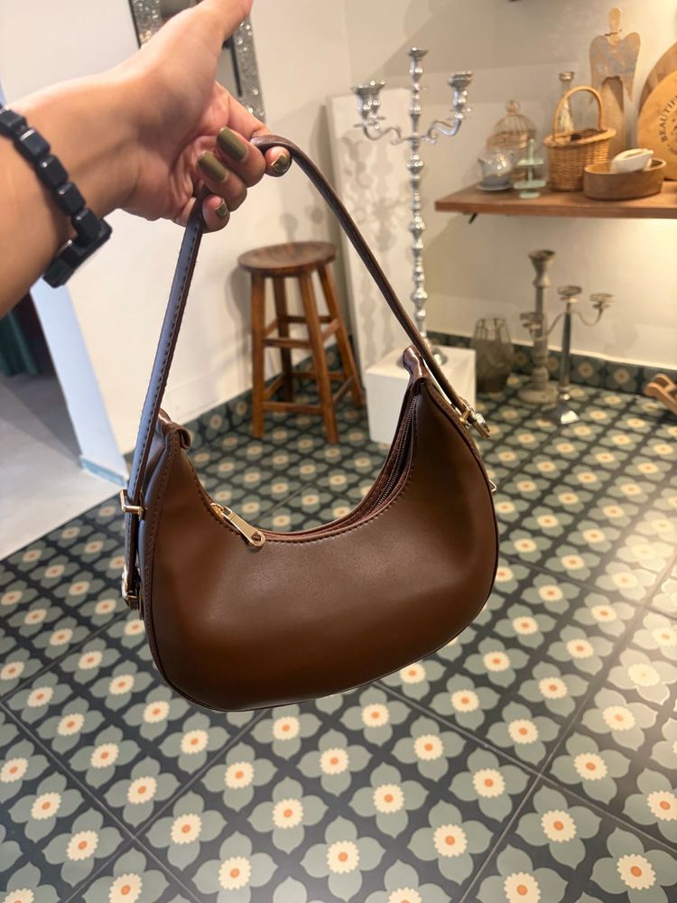 brown sling bag with belt