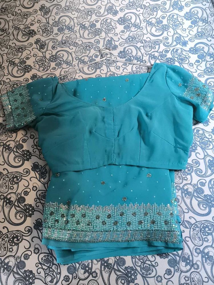 Saree With Stiched Blouse .