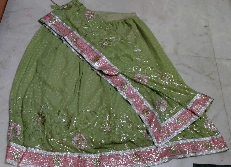 Elegant Green Sequins lehenga with Pink Border