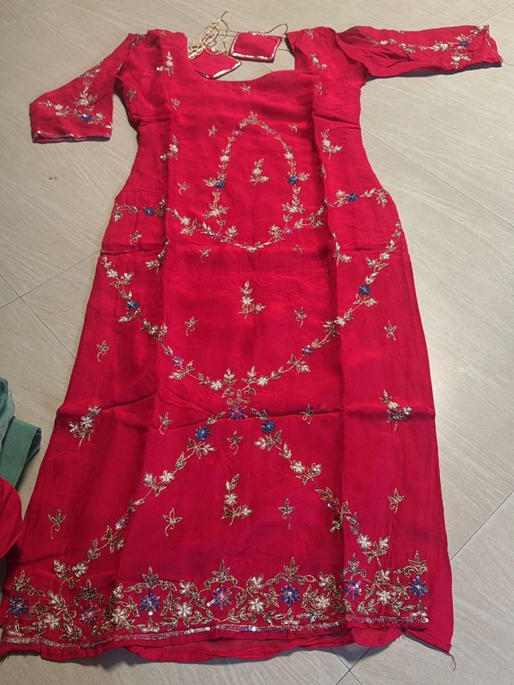 Vibrant pink suit with Silver Border