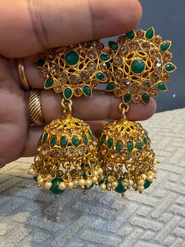 Exquisite Gold Plated Jhumka Earrings with Green S