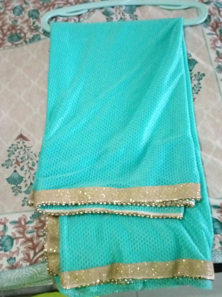 Beautiful Turquoise Saree with Gold Border
