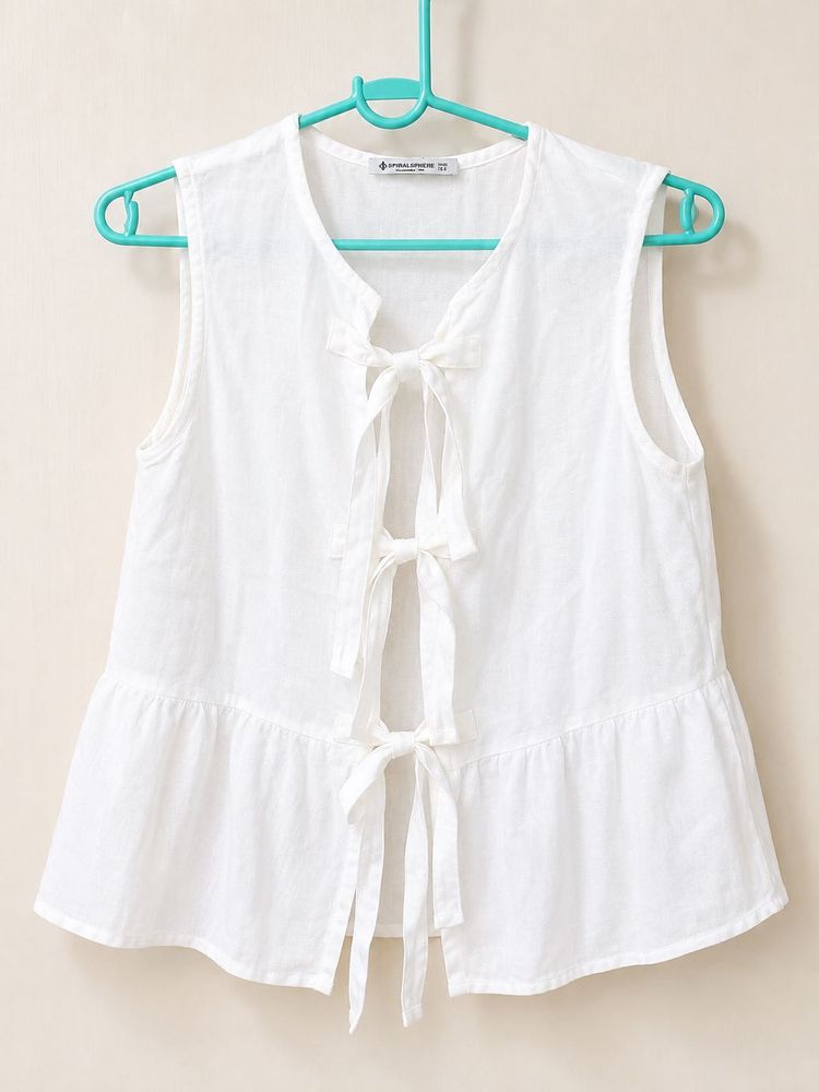 White Sleeveless Peplum Top with Bows