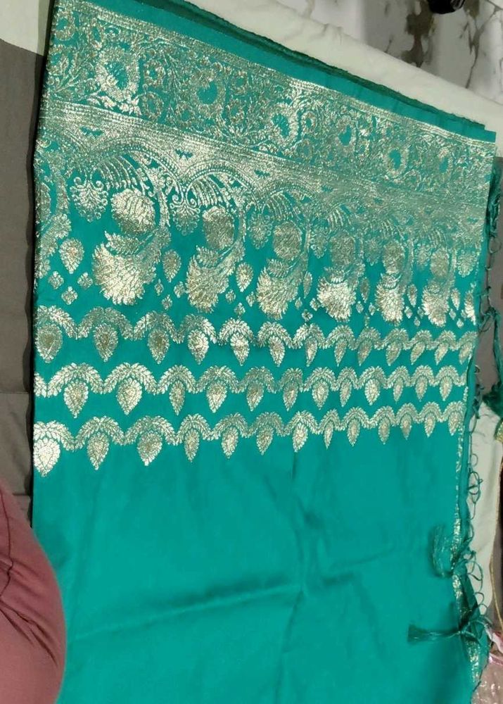 Elegant Teal Saree with Gold Embroidery