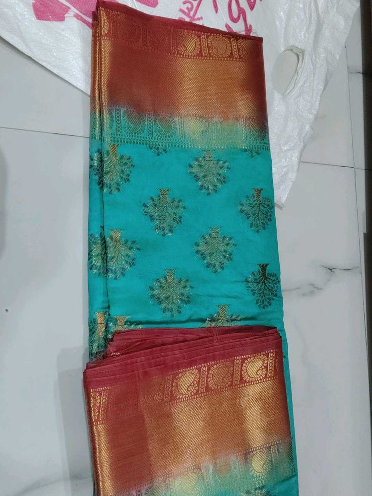 Beautiful Teal Saree with Gold Border