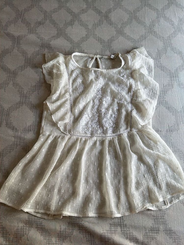 Elegant White Embroidered Peplum Top
