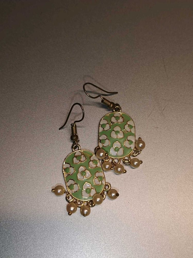 set of 3 hoops and a green meenakari earrings