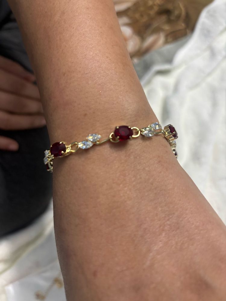 Elegant Gold Bracelet with Red and Clear Stones