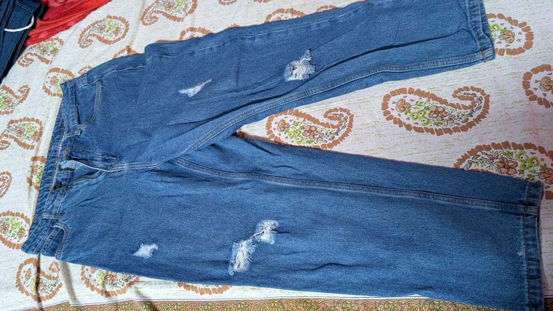Distressed Blue Denim Jeans