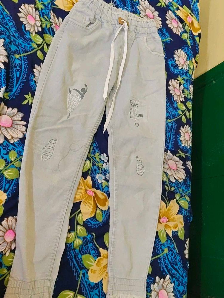Stylish Light Blue Jeans with Fun Graphics