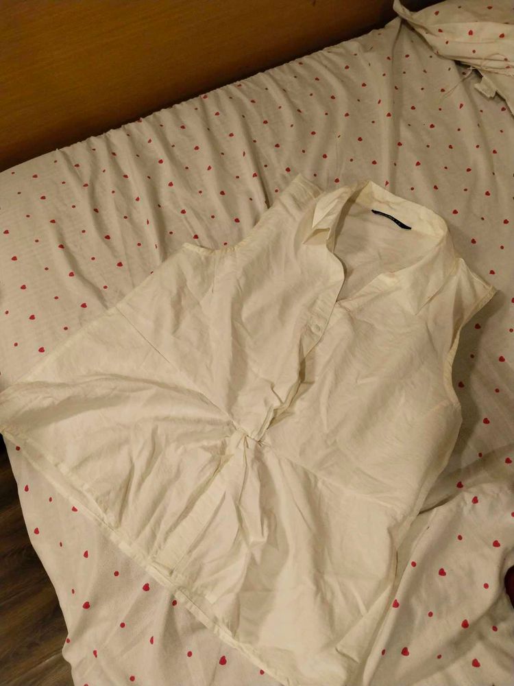 Cream Sleeveless Button-Up Top