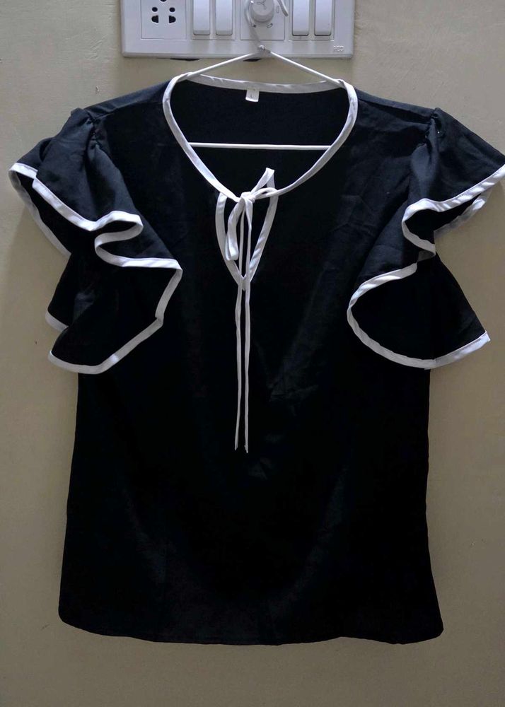 Elegant Black Top with White Accents