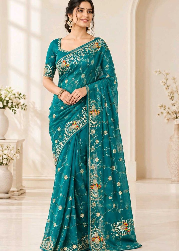 Exquisite Teal Peacock Embroidered Saree