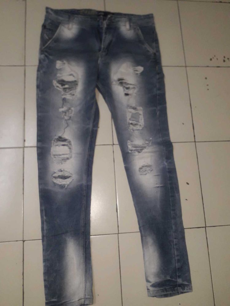 Distressed Blue Denim Jeans