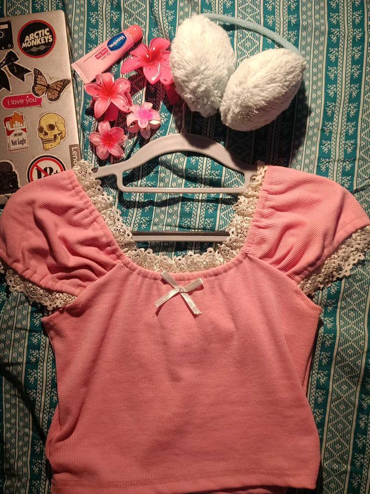 Pink lacey top with a bow