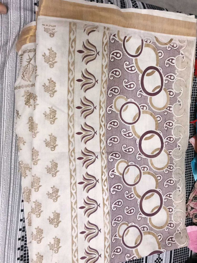 Elegant Cream Saree with Paisley Border