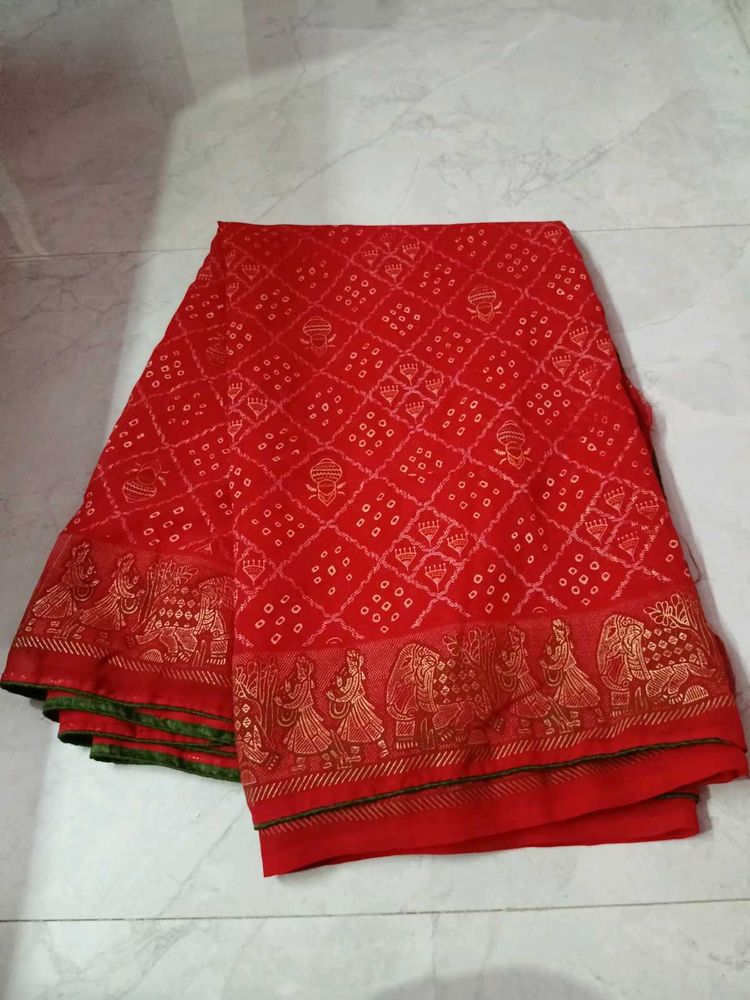 Vibrant Red Bandhani Saree with Elephant Border