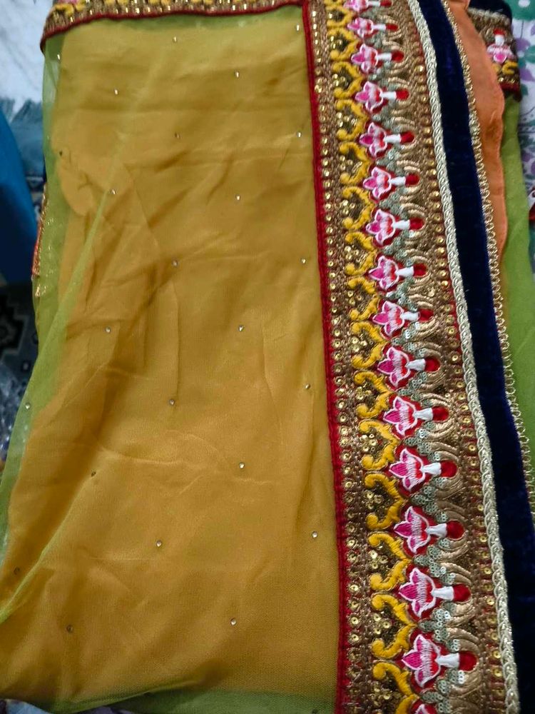 net embroidery saree with velvet blouse