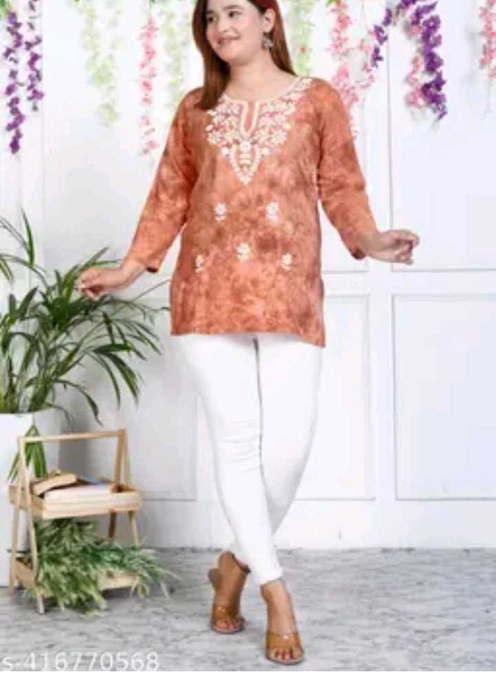 Embroidered Orange Kurti with White Pants