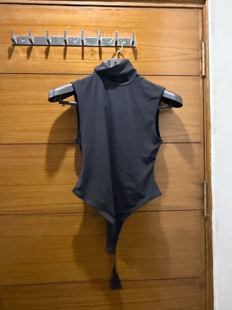 Sleek Black Turtleneck Sleeveless Bodysuit