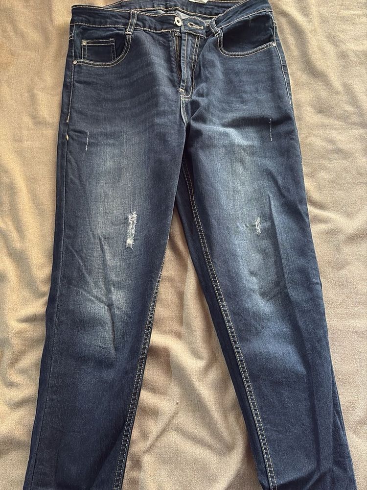 Distressed Blue Denim Jeans