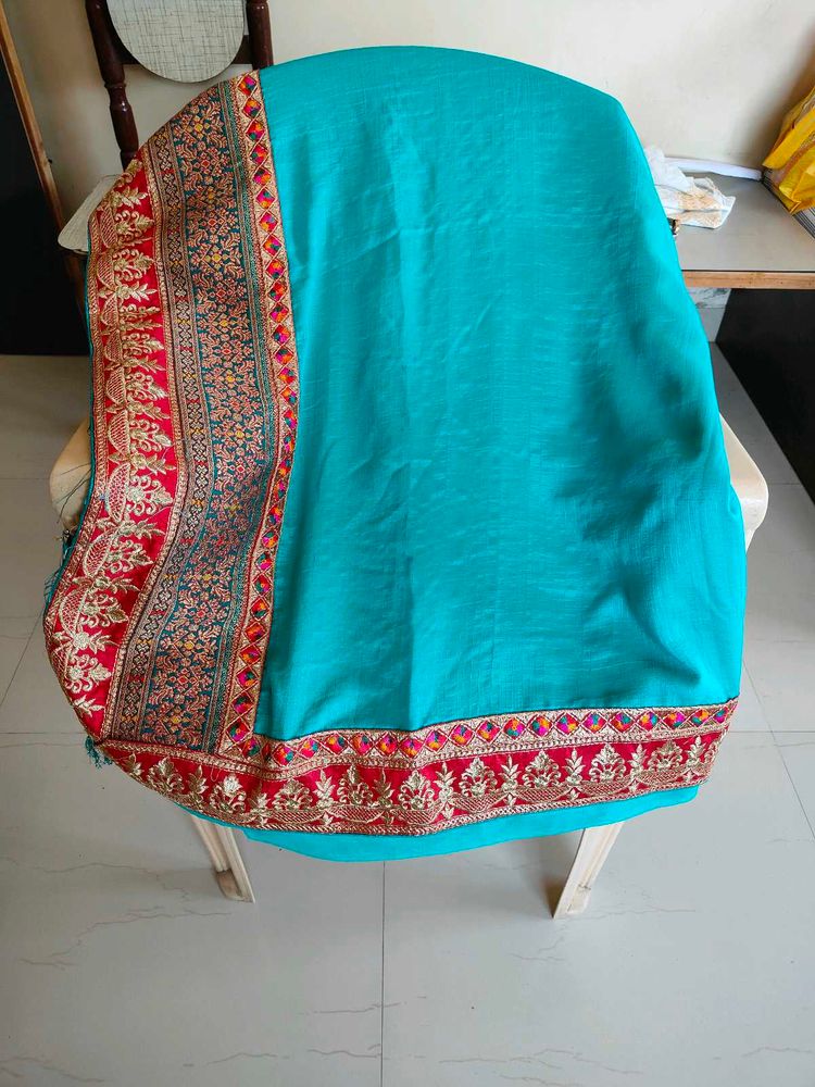 Elegant Teal Saree with Embroidered Border