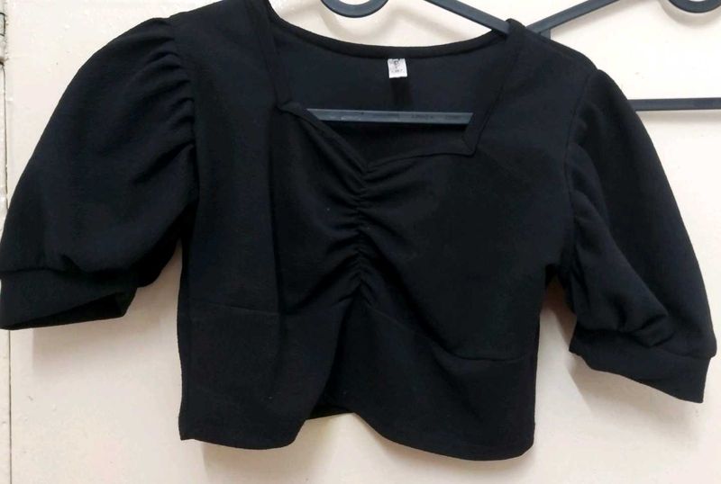 black crop top with bell sleeves