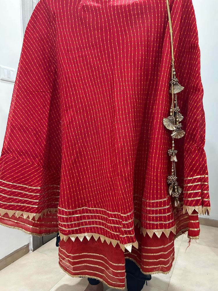 Red lehenga with matching dupatta and golden blous