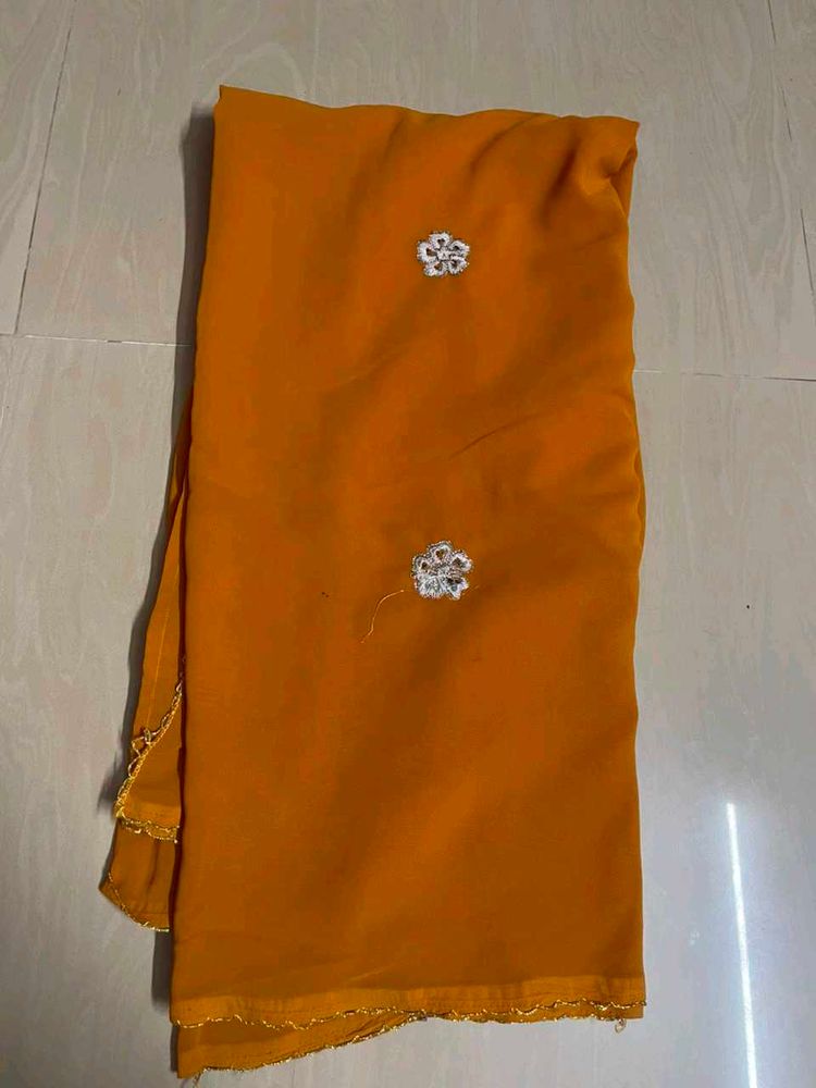 Vibrant Orange Saree with Embellishments