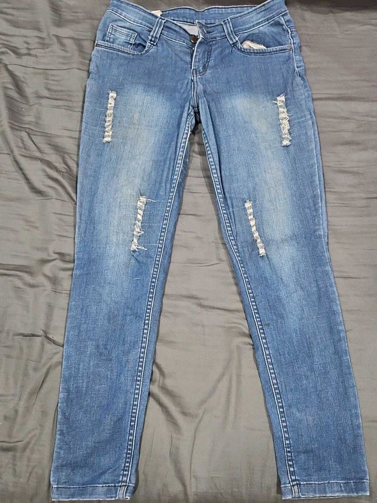 Distressed Blue Denim Jeans