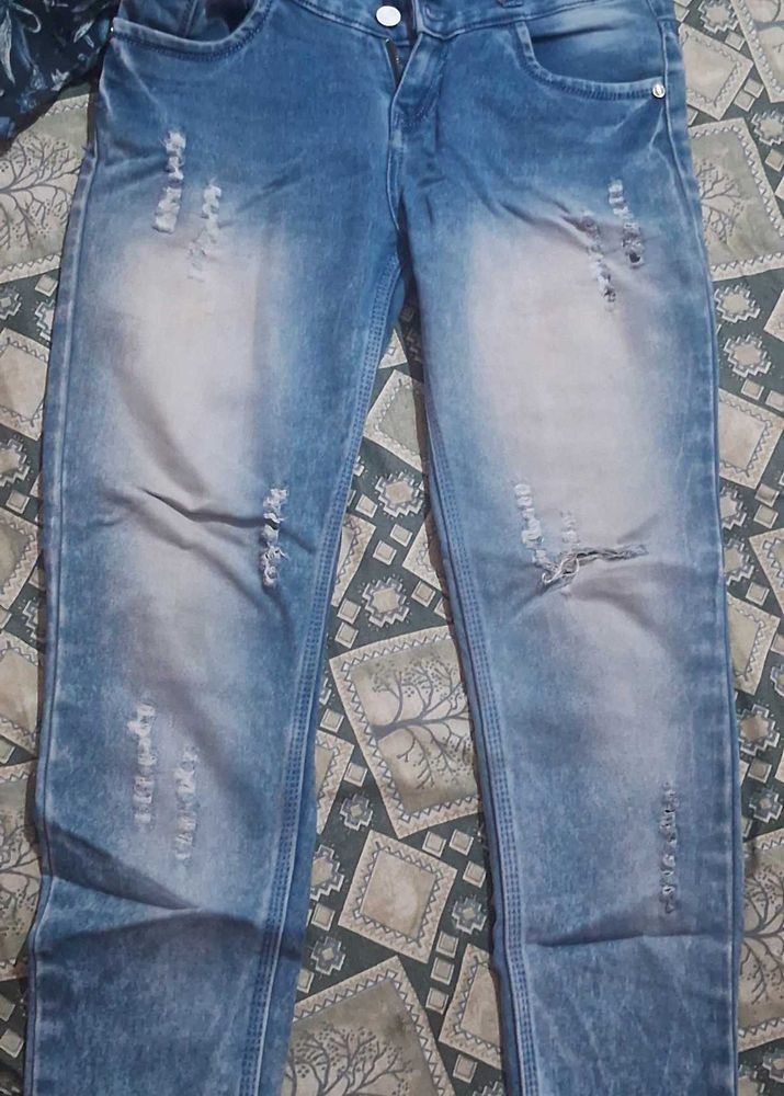 Distressed Blue Denim Jeans