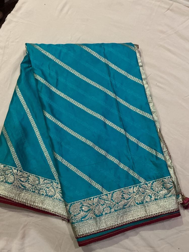Stunning Teal Saree with Silver Border