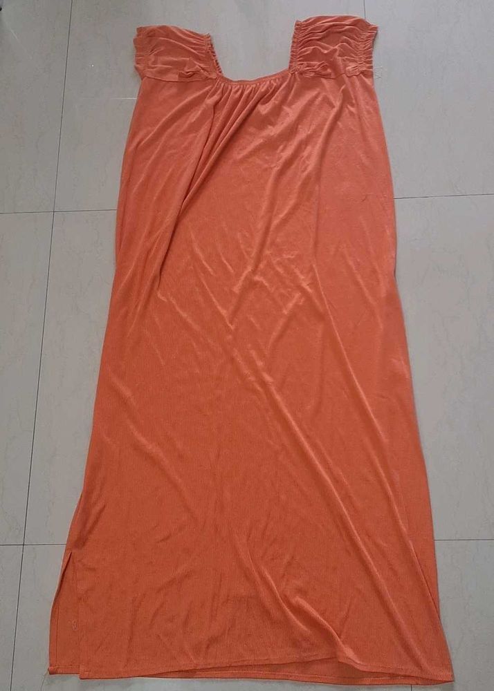 Elegant Orange Gown with Smocked Neckline