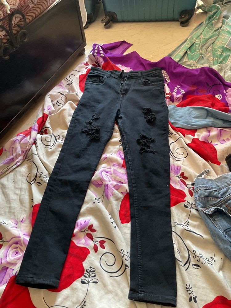 distressed ripped tattered black jeans