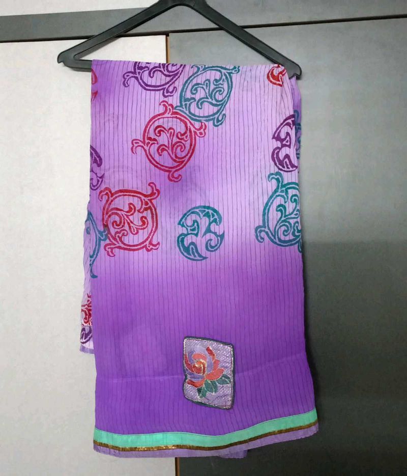 Elegant Purple Saree with Floral Border
