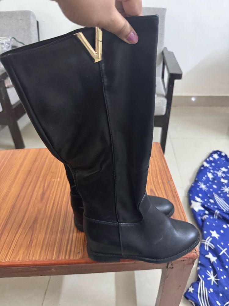 Black Knee-High Boots with Gold Accent
