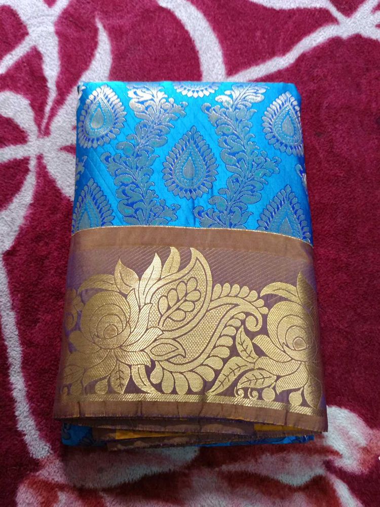 Blue Silk Saree with Gold Border