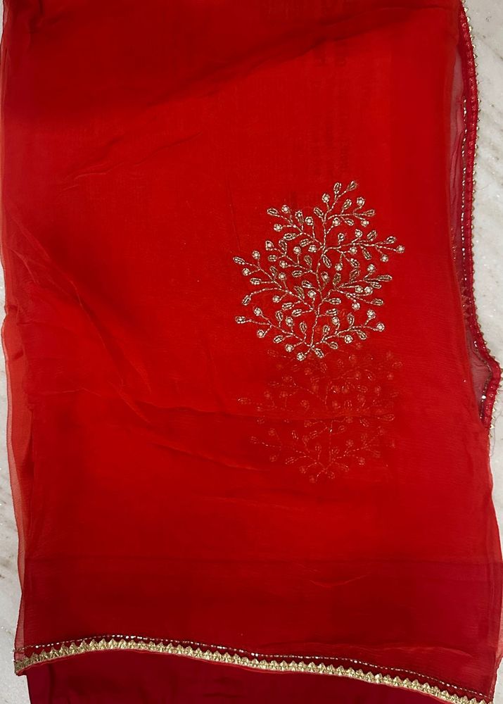 Elegant Red Saree with Gold Embellishments