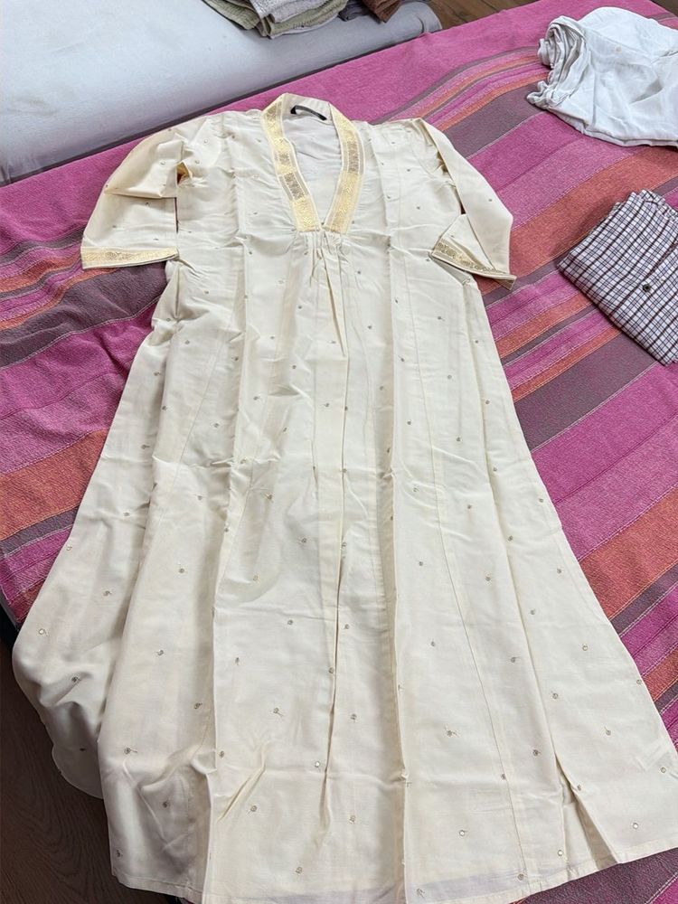 Elegant Cream Kurta with Gold Trim
