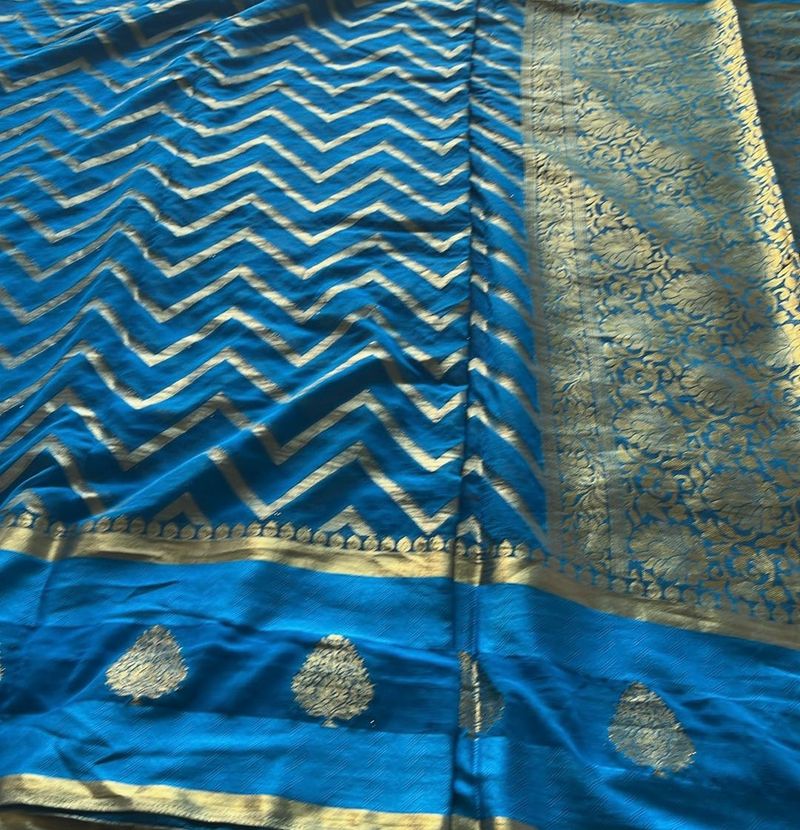 Vibrant Blue Saree with Gold Zigzag Pattern