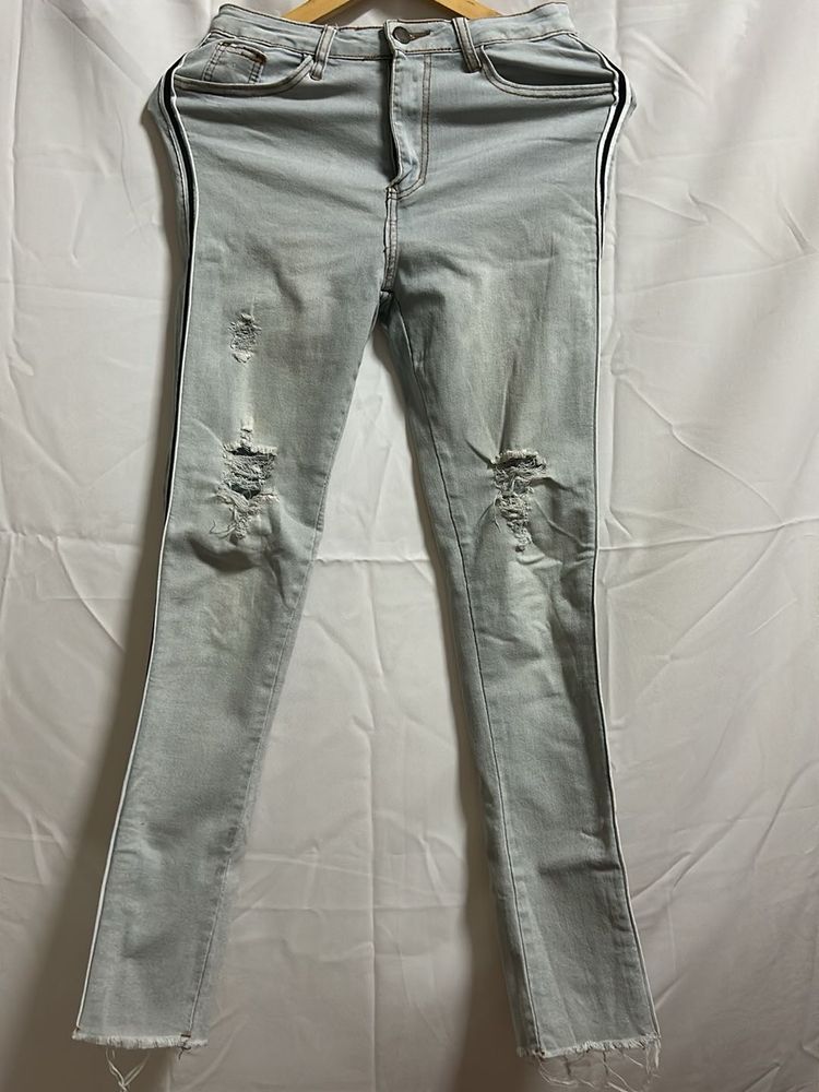 Light Wash Ripped Jeans with Side Stripe