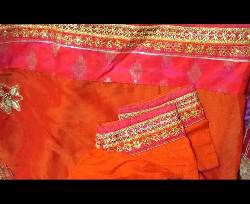 Vibrant Orange Saree with Pink Border