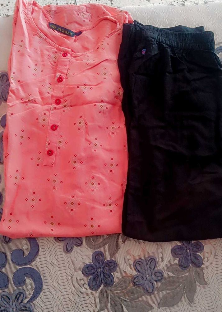 Stylish Peach Printed Kurta with Black plazo.