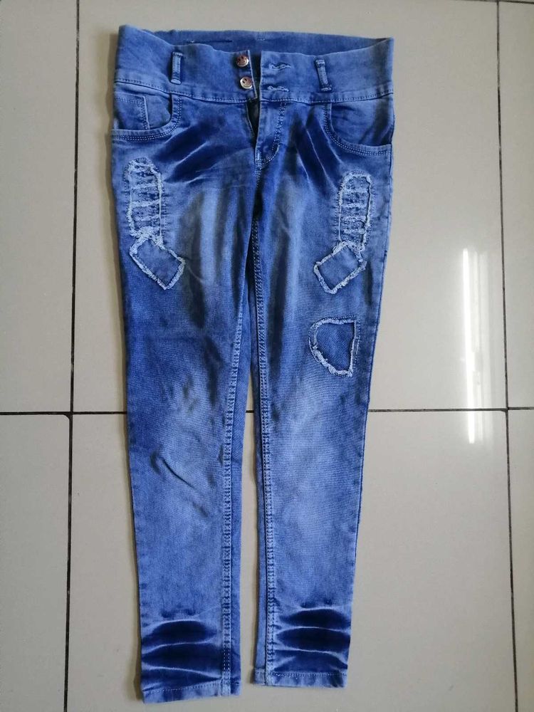 Distressed Blue Denim Jeans