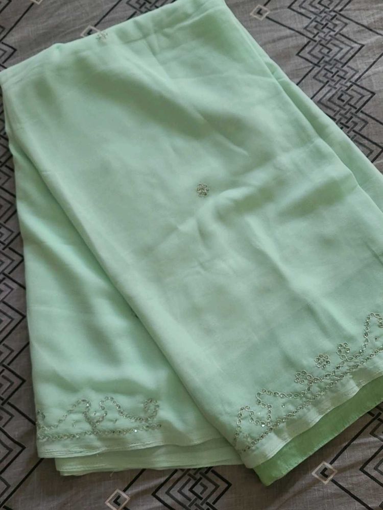 Elegant Mint Green Embellished Saree