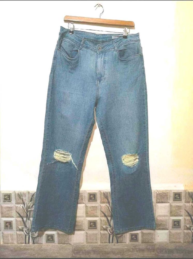 Distressed Blue Denim Jeans
